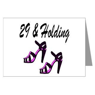 29 holding greeting card