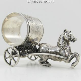 PULLING FIGURAL NAPKIN RING Antique SILVERPLATE Working Wheels RARE