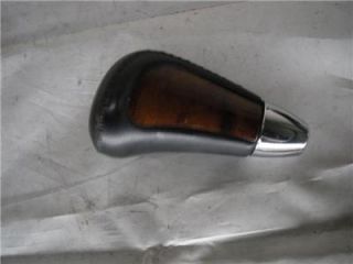 You are looking at an OEM used WOODGRAIN/BLACK LEATHER shift knob that